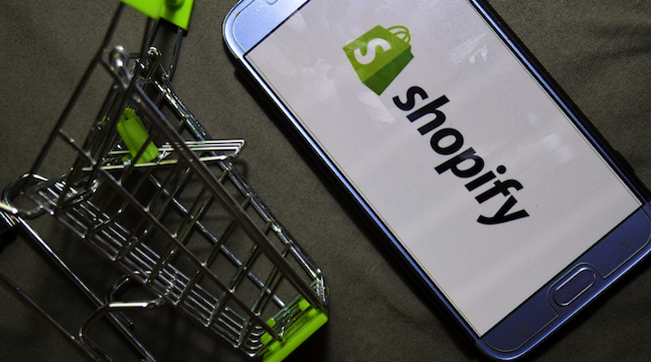 Image of Shopify logo on phone screen.